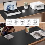Aothia black faux leather desk pad, rectangular, shown with a laptop, mouse, and keyboard on a desk.