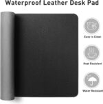 Aothia black faux leather desk pad, rectangular, shown with a laptop, mouse, and keyboard on a desk.