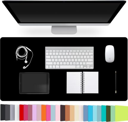 Black leather desk pad protecting a wooden desk, with a laptop and mouse on its surface, viewed from above.