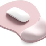 Pink oval mouse pad with an integrated gel wrist rest, designed for ergonomic support and smooth mouse movement.