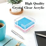 Clear acrylic square holder for 3x3 inch sticky notes, empty and showing its transparent design on a clean desk.