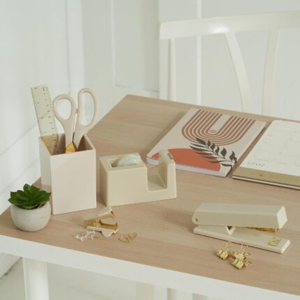 A complete 10-piece KIBAGA desk organizer set in beige and gold, including a stapler, scissors, pen holder, and tape dispense