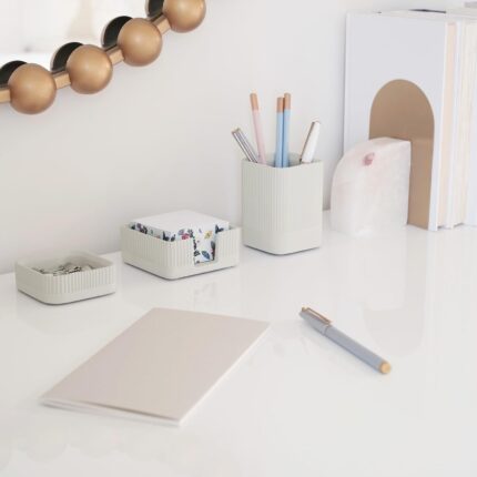 A set of three gray concrete desk organizers, including a tall pen holder, a square notes holder, and a small metal clip hold