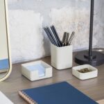 A set of three gray concrete desk organizers, including a tall pen holder, a square notes holder, and a small metal clip hold