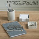 A set of three gray concrete desk organizers, including a pen holder, a notes holder, and a small dish for clips, arranged on