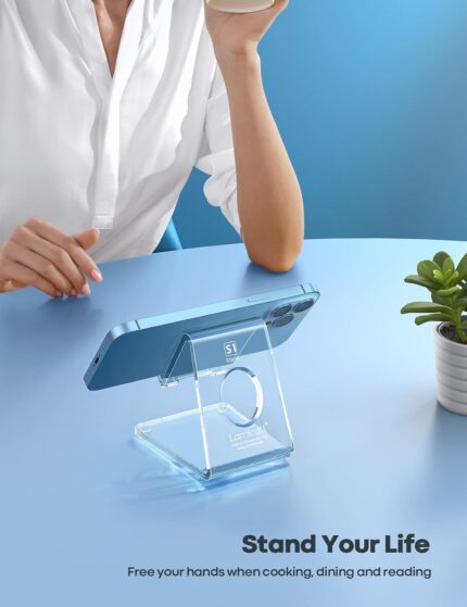 A clear acrylic cell phone stand holding a smartphone on a desk, showcasing its transparent design and cable management.